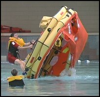 Coast Guard's Senior Rescue Swimmer demos righting a life raft