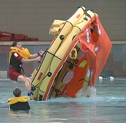 Coast Guard's Senior Rescue Swimmer demos righting a life raft